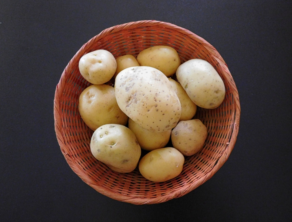 potatoes on wooden background