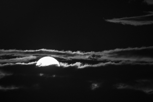 Moon rising through the Clouds