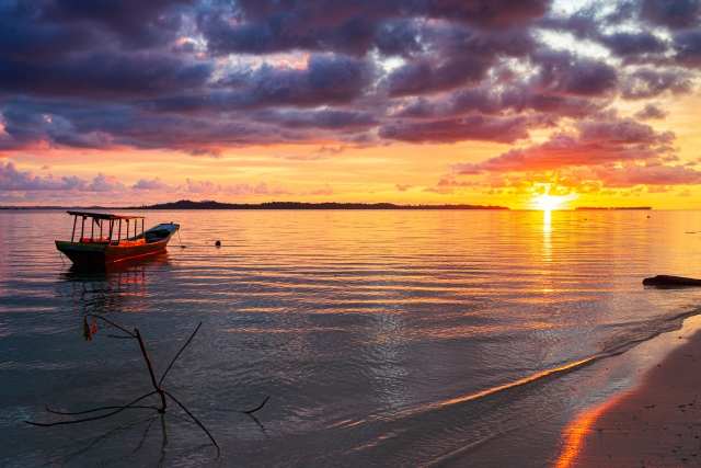 Sunset colorful sky on sea, tropical desert beach