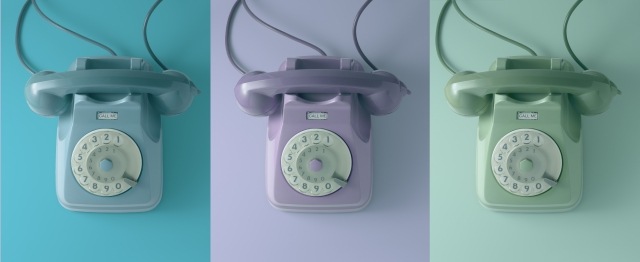 Colored vintage dial telephones.