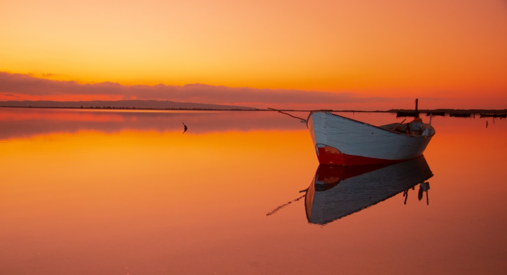 fisherman boat with beautiful sunset