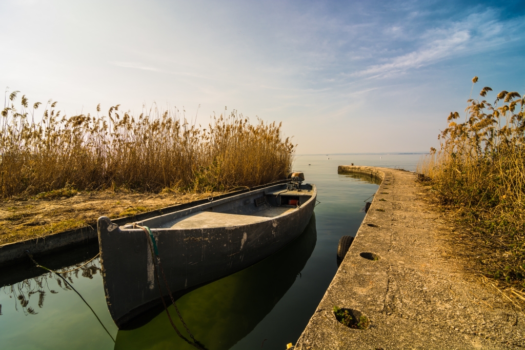 small motor boat moored in a canal